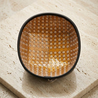 The Luxuel Laser Cap 272 dome insert seen at an angle on travertine, showing the depth of the laser array across its inner face
